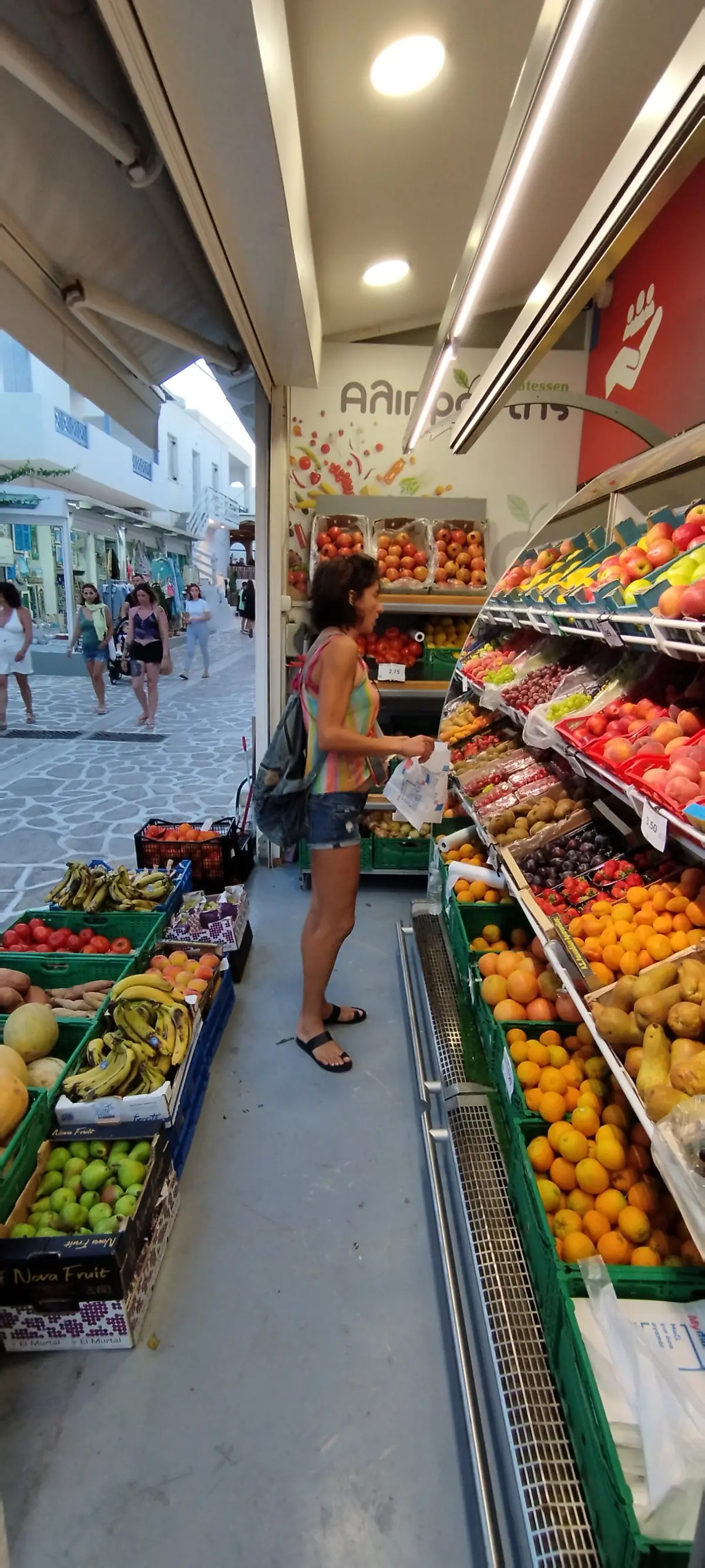 Sailing holiday vegan staples pre-stocked in a sailboat galley and fresh Greek island market produce